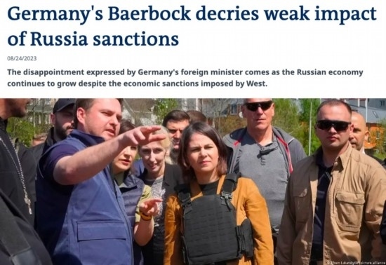 △“德國之聲”網(wǎng)站報(bào)道截圖（題圖中間為貝爾伯克）